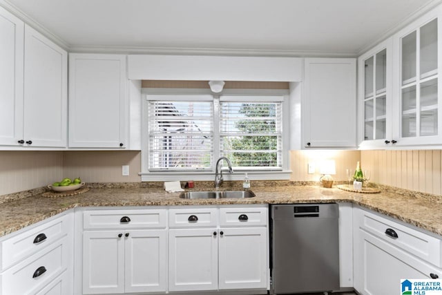 kitchen featuring light stone countertops, white cabinetry, sink, and stainless steel dishwasher