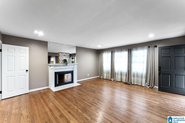 unfurnished living room with hardwood / wood-style floors