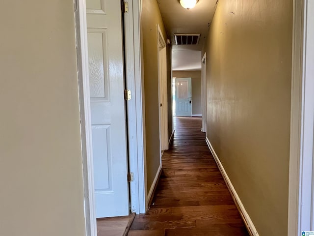 hall with dark hardwood / wood-style flooring