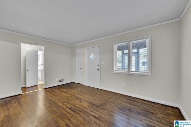 foyer featuring crown molding and dark hardwood / wood-style floors