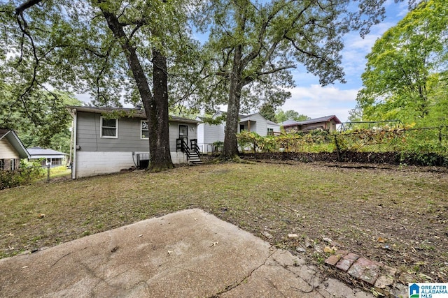 rear view of house with a yard