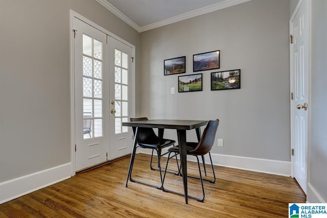 office featuring french doors, ornamental molding, and hardwood / wood-style floors