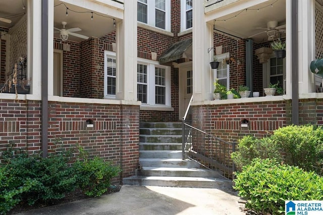 entrance to property featuring ceiling fan