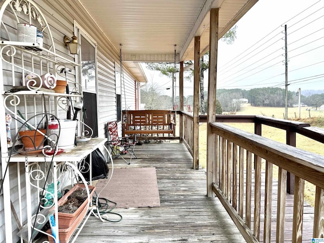 wooden deck featuring covered porch