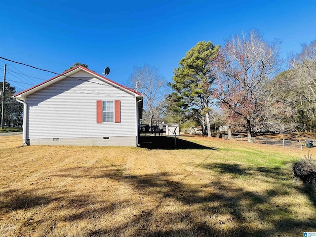 view of property exterior with a lawn