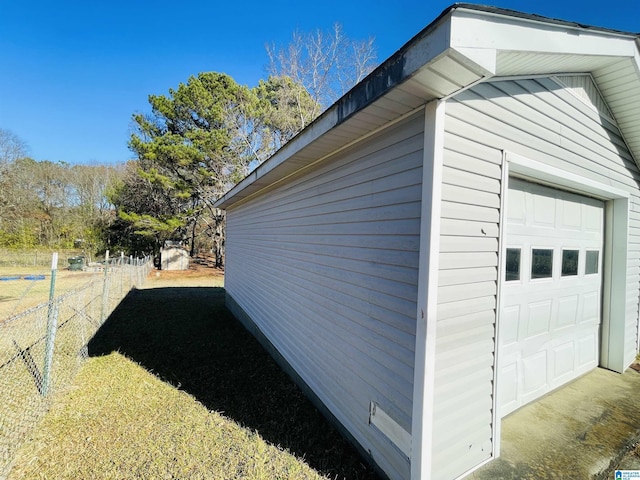 view of side of home with an outdoor structure and a garage