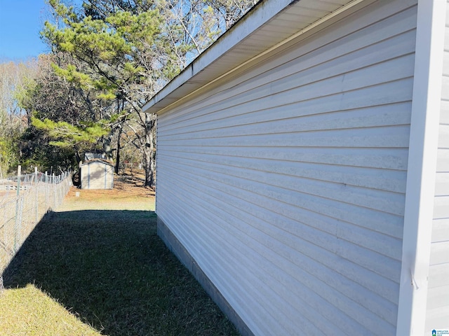 view of property exterior with a shed