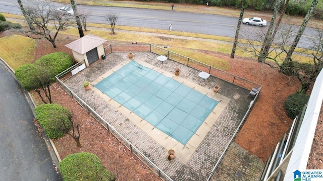 view of pool featuring tennis court