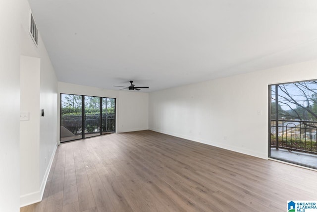 unfurnished room featuring ceiling fan and wood-type flooring