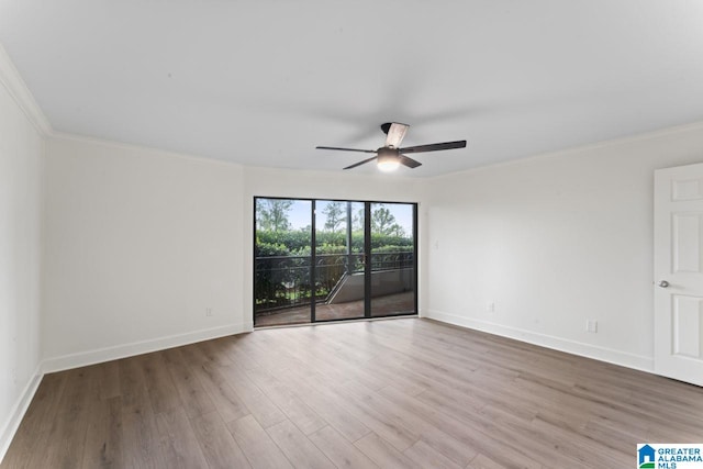 unfurnished room featuring crown molding, hardwood / wood-style floors, and ceiling fan