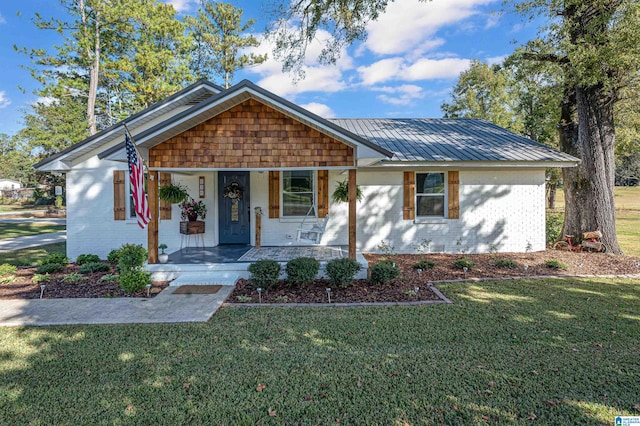 view of front of house featuring a front yard and a porch