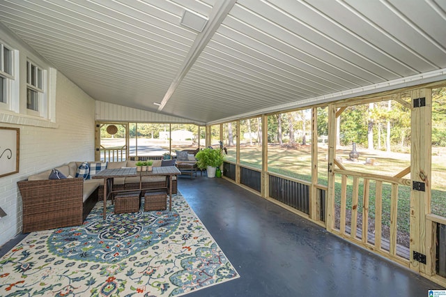 sunroom / solarium with lofted ceiling