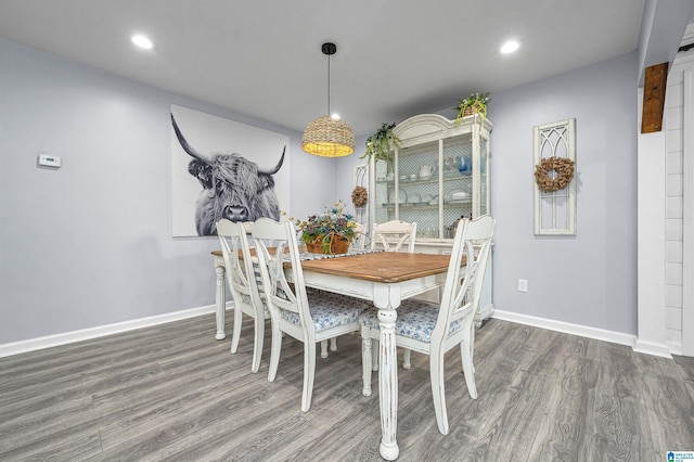 dining area with dark hardwood / wood-style floors