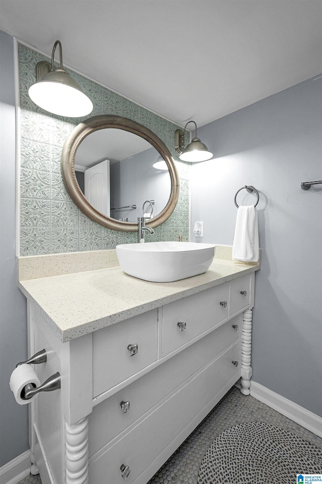 bathroom featuring tile patterned flooring and vanity