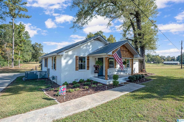 bungalow-style home featuring a front yard