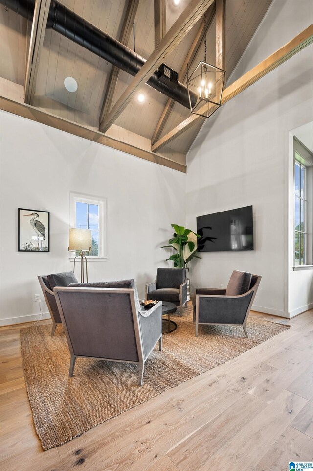 1616 Skye Pass, Hoover, AL 35244 - living room featuring a chandelier, plenty of natural light, and light hardwood / wood-style floors