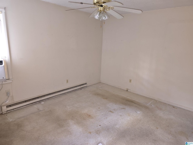 carpeted spare room with baseboard heating