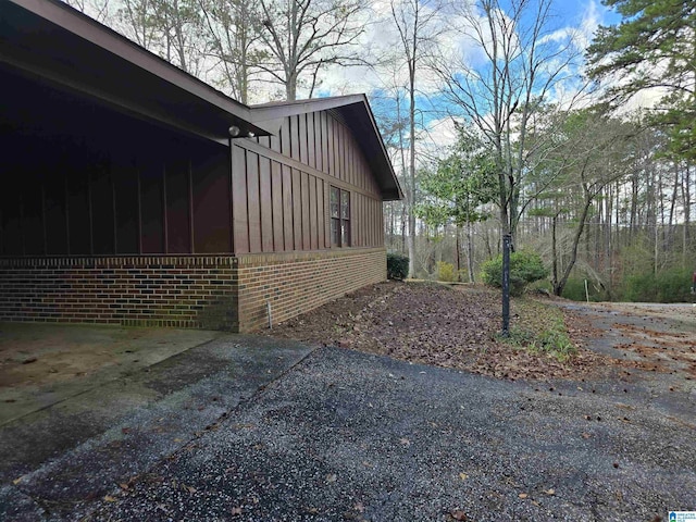 view of side of property featuring a sunroom