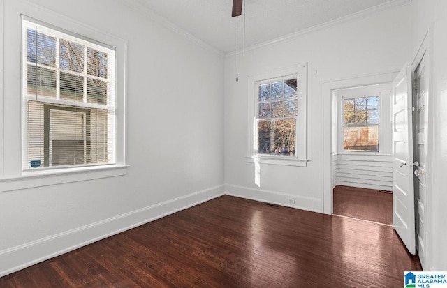 spare room featuring ceiling fan, dark hardwood / wood-style flooring, and ornamental molding