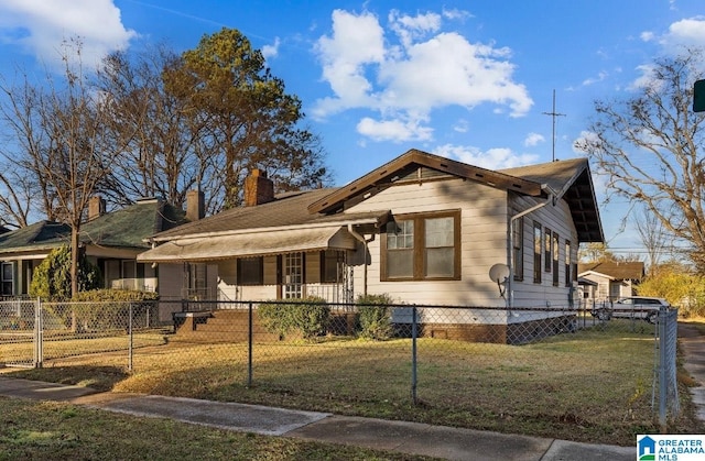 bungalow-style house with a front yard