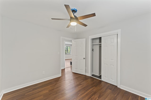 unfurnished bedroom featuring a closet, ceiling fan, and dark hardwood / wood-style floors