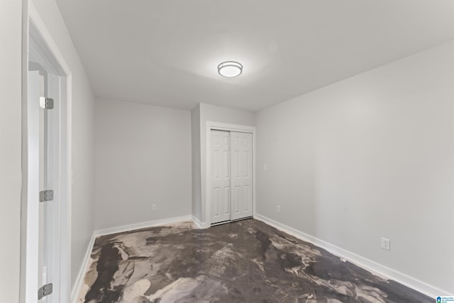 unfurnished bedroom featuring a closet