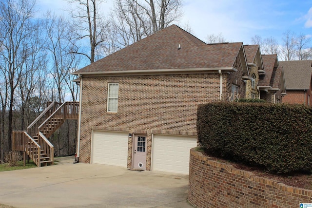 view of side of home featuring a garage