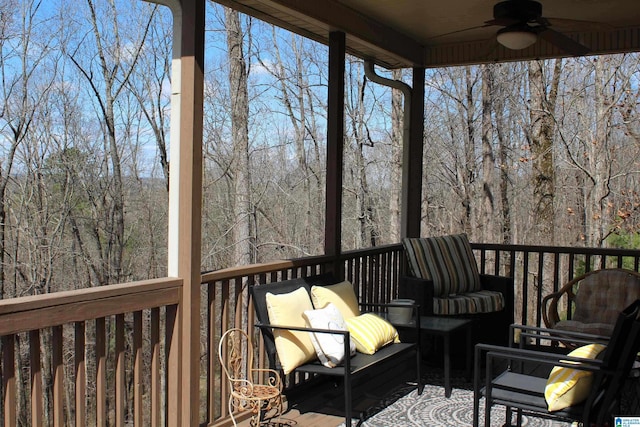 wooden terrace featuring ceiling fan