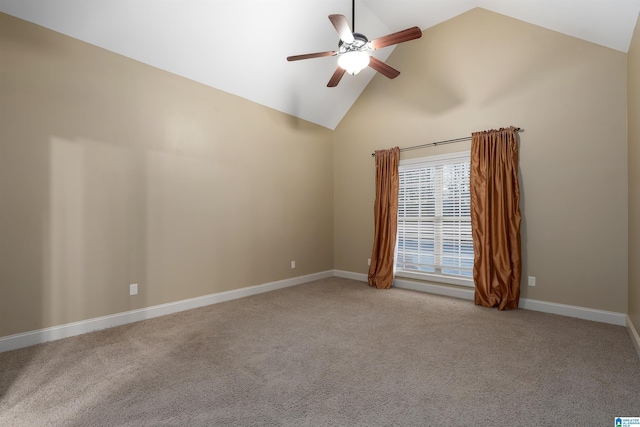 spare room featuring high vaulted ceiling, light colored carpet, and ceiling fan