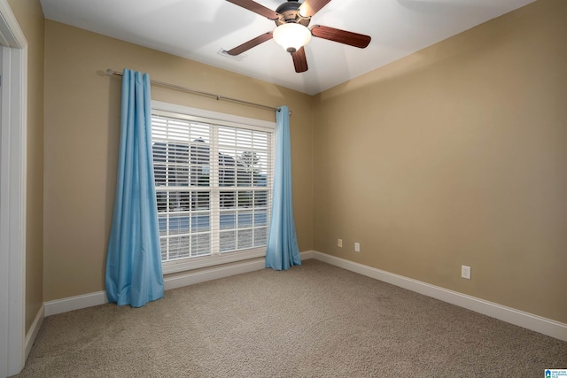 carpeted empty room with ceiling fan