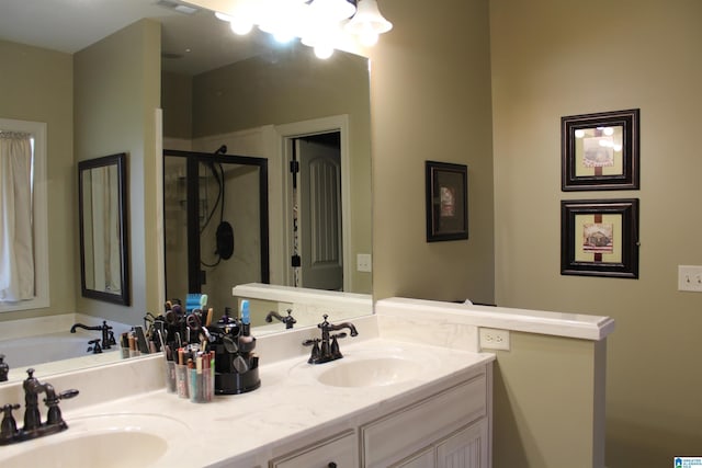 bathroom with vanity and an enclosed shower