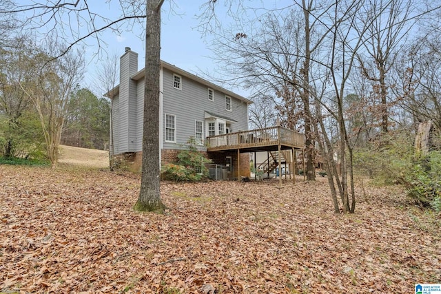 back of property with a deck