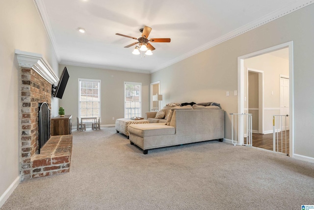 living room featuring carpet flooring, a brick fireplace, ceiling fan, and ornamental molding