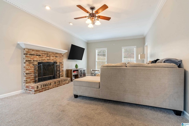 living room with carpet flooring, ceiling fan, crown molding, and a brick fireplace