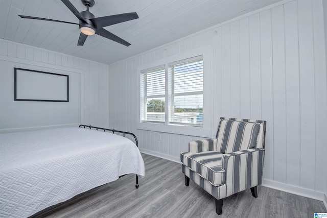 bedroom with hardwood / wood-style flooring and ceiling fan