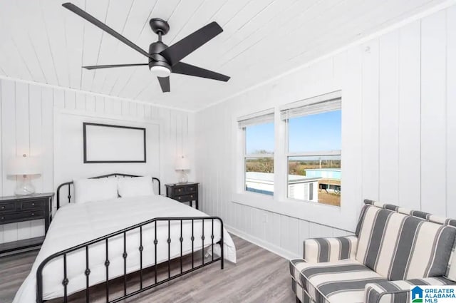 bedroom with hardwood / wood-style flooring, ceiling fan, and wooden ceiling
