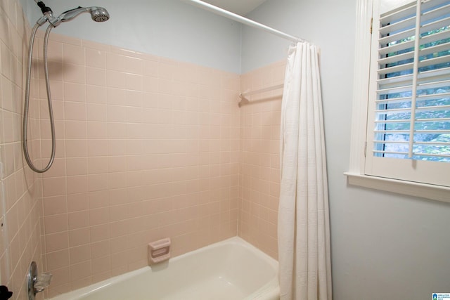 bathroom featuring shower / bath combination with curtain