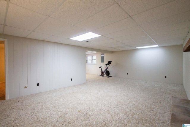 basement with carpet and a drop ceiling