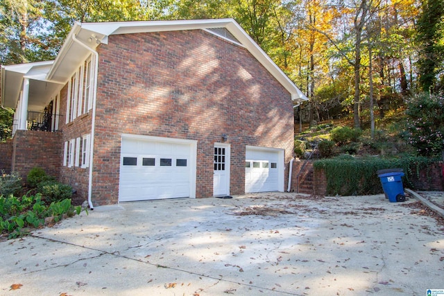 view of side of property with a garage