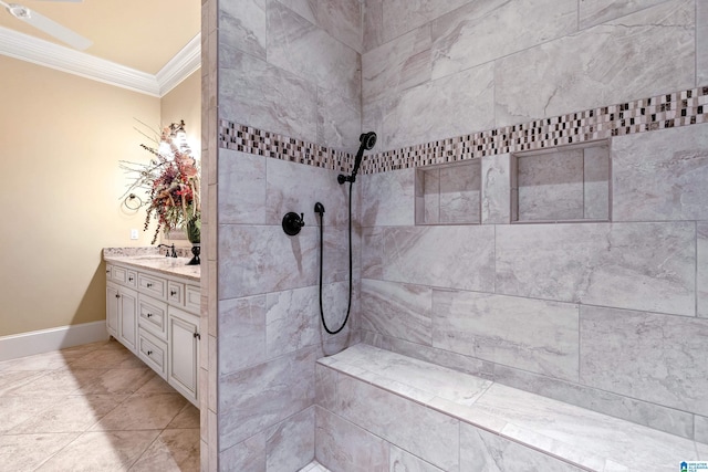 bathroom with tile patterned floors, crown molding, and vanity