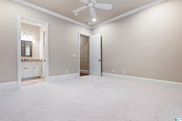 unfurnished bedroom with ensuite bathroom, sink, ceiling fan, and ornamental molding