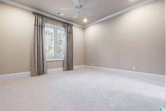 spare room featuring ceiling fan, carpet, and ornamental molding