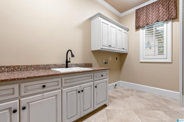 laundry area with cabinets, sink, washer hookup, ornamental molding, and hookup for an electric dryer