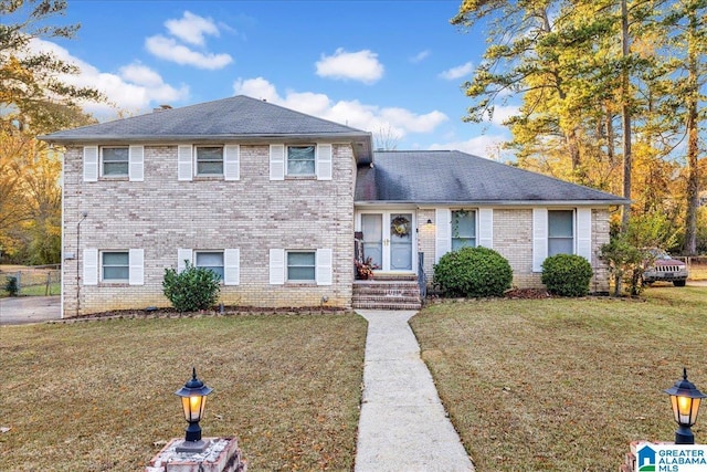 split level home with a front lawn