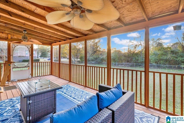 sunroom featuring ceiling fan