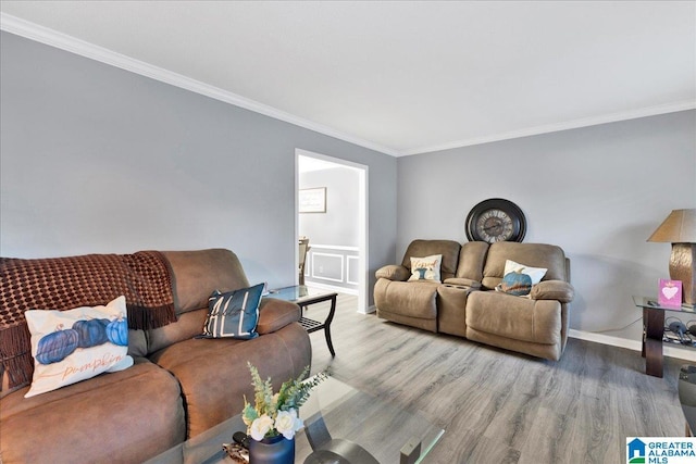 living room featuring wood-type flooring and crown molding