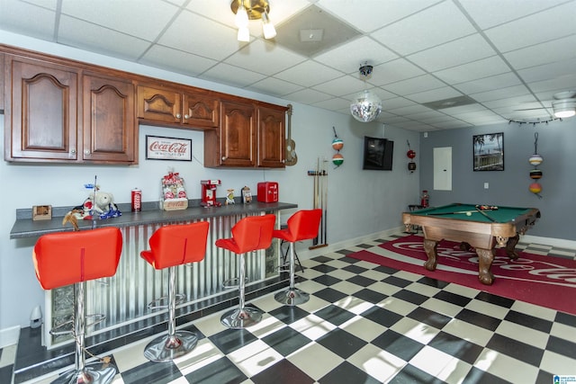 bar featuring a paneled ceiling and billiards