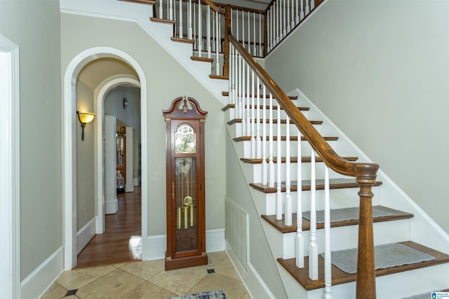 staircase with tile patterned floors