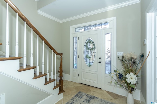 foyer featuring crown molding and light tile patterned flooring