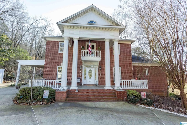 neoclassical / greek revival house with a balcony